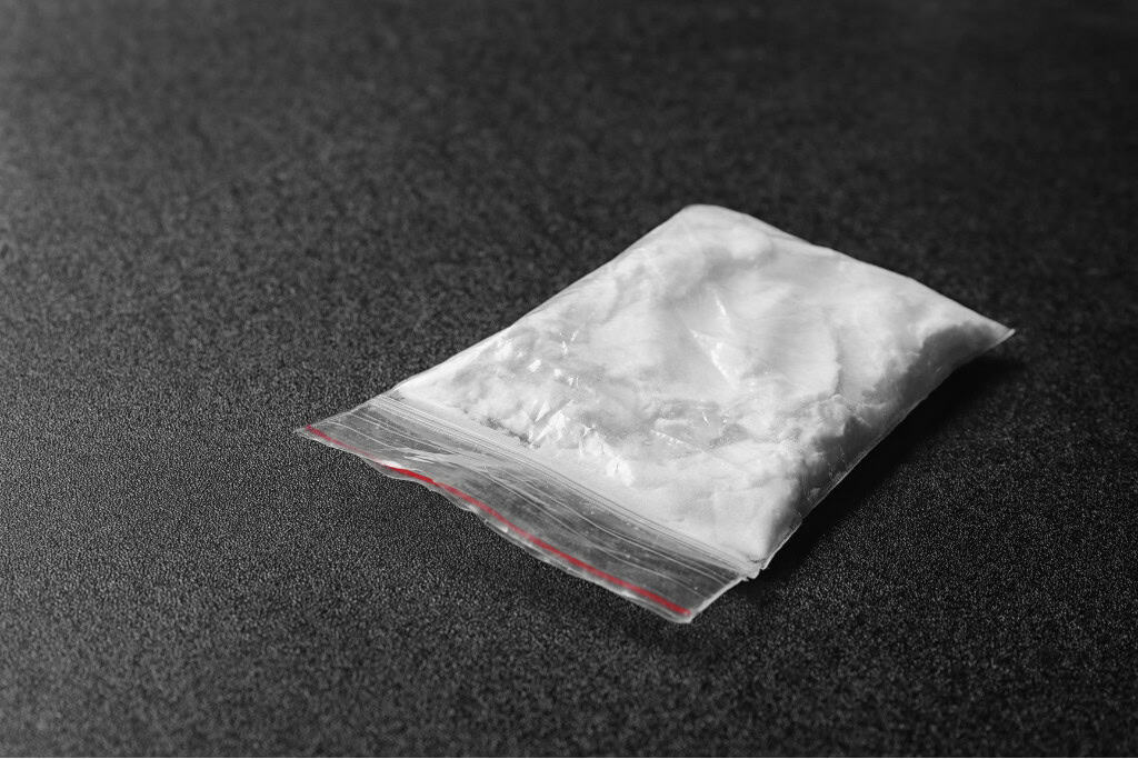 Close-up image of a small plastic bag containing a white powder, representing substances associated with addiction. This image relates to cocaine rehab in Reseda CA.