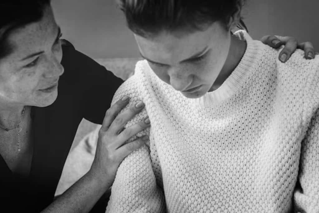 A comforting moment as one woman supports another, representing the empathy and understanding offered in depression treatment in Reseda, CA.